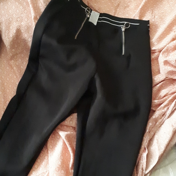 A shirt that has the word trouble, and black pants - Picture 2 of 2